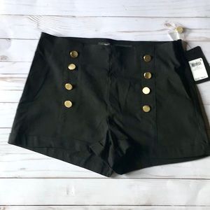 Black shorts with gold buttons